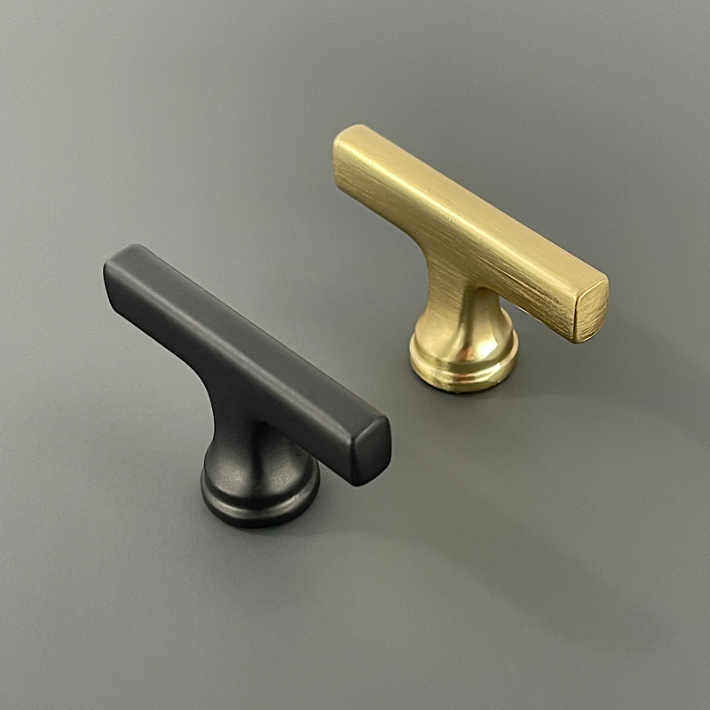 Aintree smooth cabinet knobs in black and brass finishes